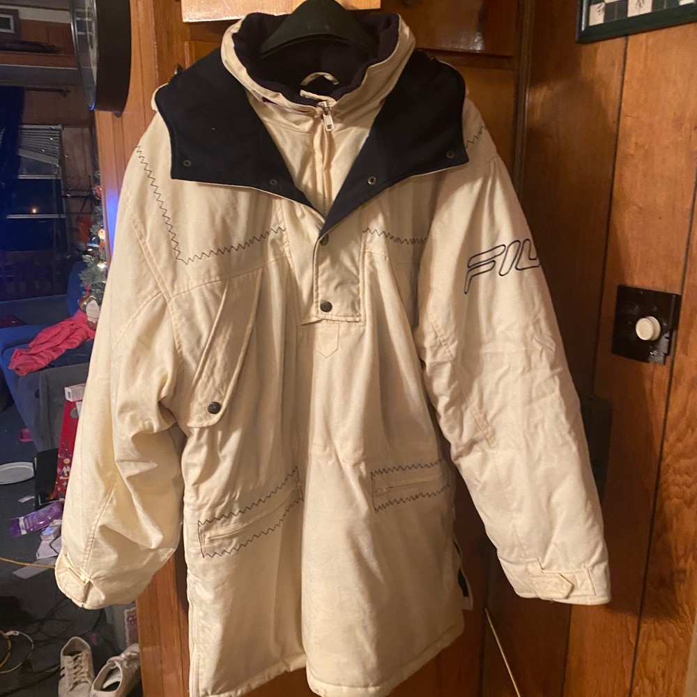 Vintage Fila pullover jacket with quarter length front zipper and side zippers.